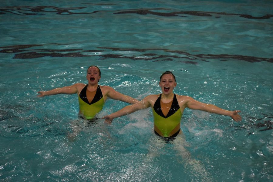 Senior Rachel Katzovitz and junior Mae Turman soar out of the water in their routine May 17. Synchronized swimming commemorated the end of the regular season with a large “razzle dazzle” event Wednesday.