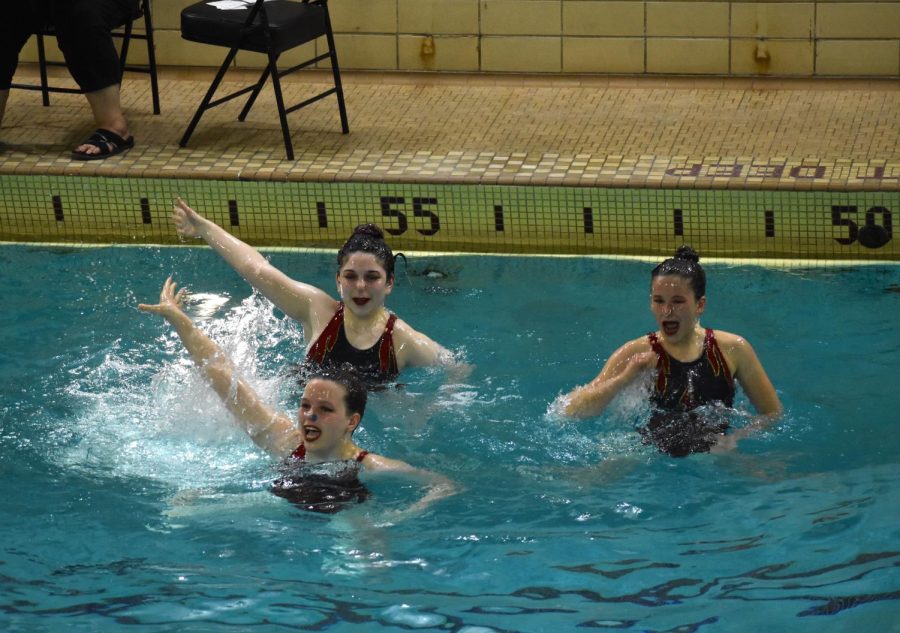 Freshmen Lexa Rischall, Kaylee Crump and Axel OHara swim in their long trio routine on May 20. The group got first place with the trio routine on Saturday.
