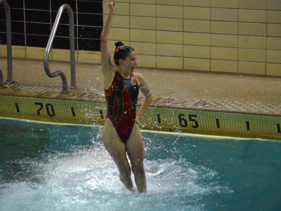 Freshman Kaylee Crump spins in the air during her long trio routine on May 20. The team placed first in the long trio event on Saturday.