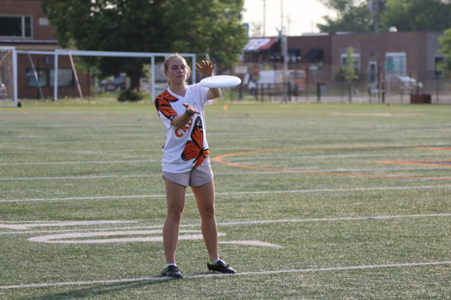 Junior Jersey Miller catches the disk during match. She is one of the teams newest members.