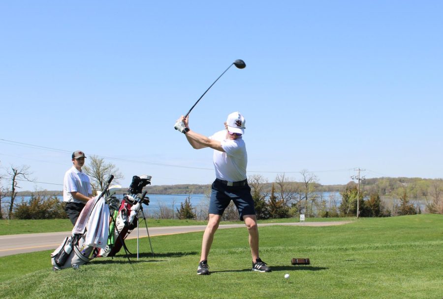 Senior Miles Rider winds up for a swing May 8. Golf had a meet where they placed sixth out of eight at Island View in Waconia. 