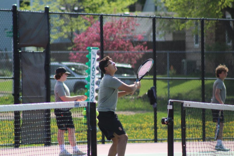 Sophomore Josh Fink prepares to return the ball May 15. Fink won his individual match, contributing to the teams overall 5-2 win against Minneapolis South.
