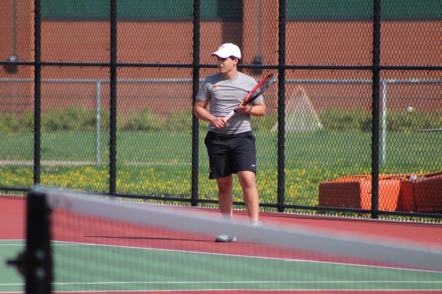 Sophomore Isaac Joseph readies to return the ball to his opponent May 15. The match day at home resulted in an overall score of 5-2 against Minneapolis South. 