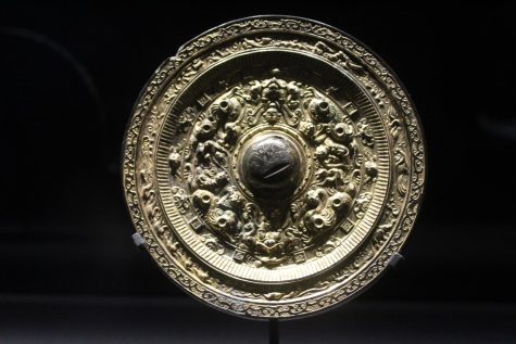 An ancient Chinese mirror is shown in the exhibit “Eternal Offerings: Chinese Ritual Bronzes” at the Minneapolis Institute of Art April 30. The exhibit combines ancient Chinese ritual objects with modern multimedia. 