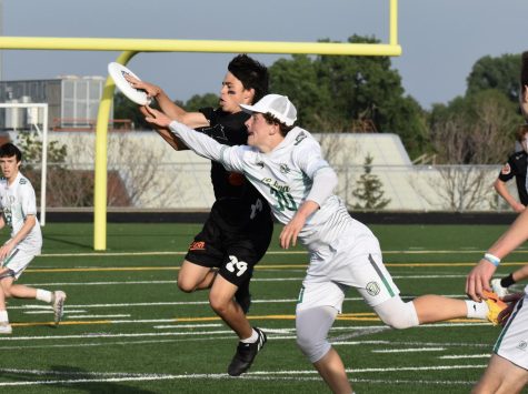 Ryan Steinberg catches the frisbee while evading an Edina player June 7. Crush ended up losing the game 11-10 against Edina