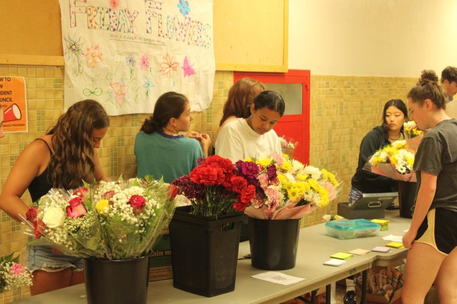 Sophomore Evelyn Barnett approaches the Friday Flowers table June 2. The friday flowers has been a very successful fundraiser.