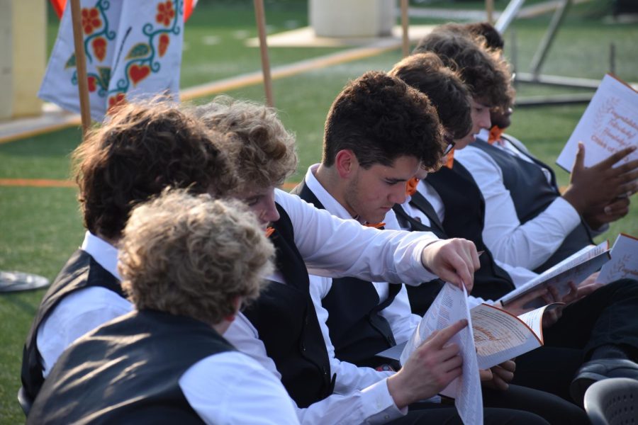 Park Singers look over the graduation program June 6. Graduation featured musical performances from both Park Singers and Wind Ensemble.