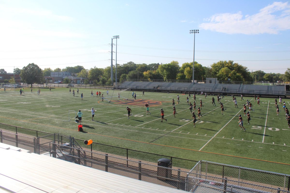 Football and soccer teams practicing on the same field Sept. 20. This has been an issue since the construction of the new practice field and has caused a lot of headaches for the coaches trying to get the most field time possible. 