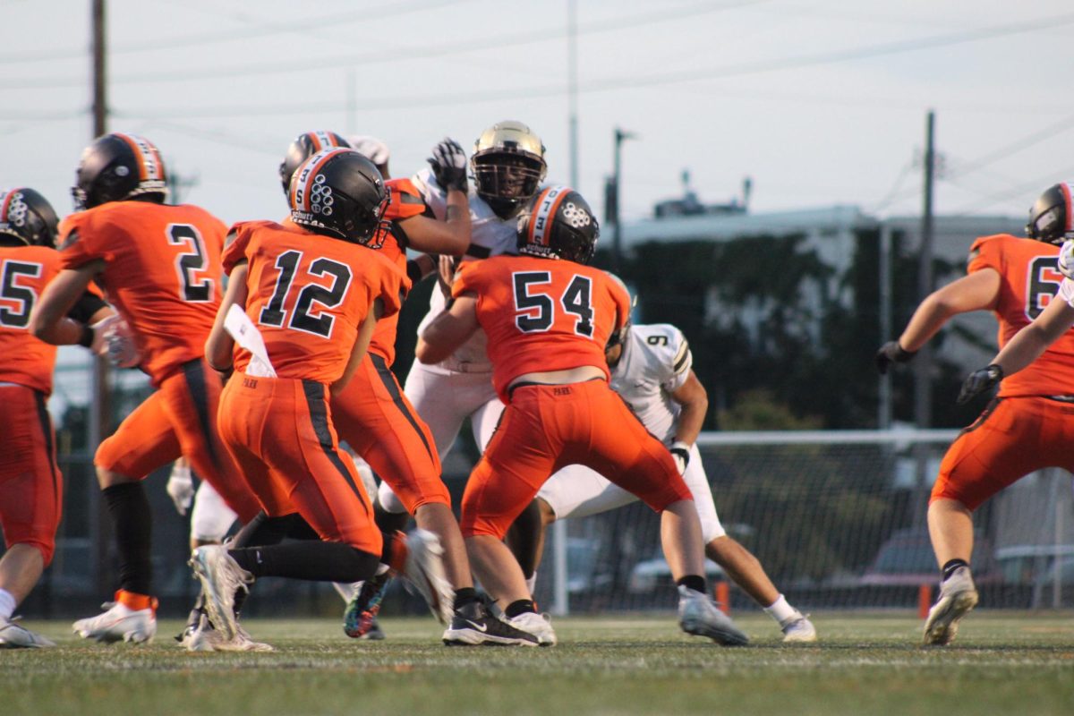 The Orioles offensive line works hard to protect the sophomore QB Sept. 14. This play earned the Orioles a first down. 