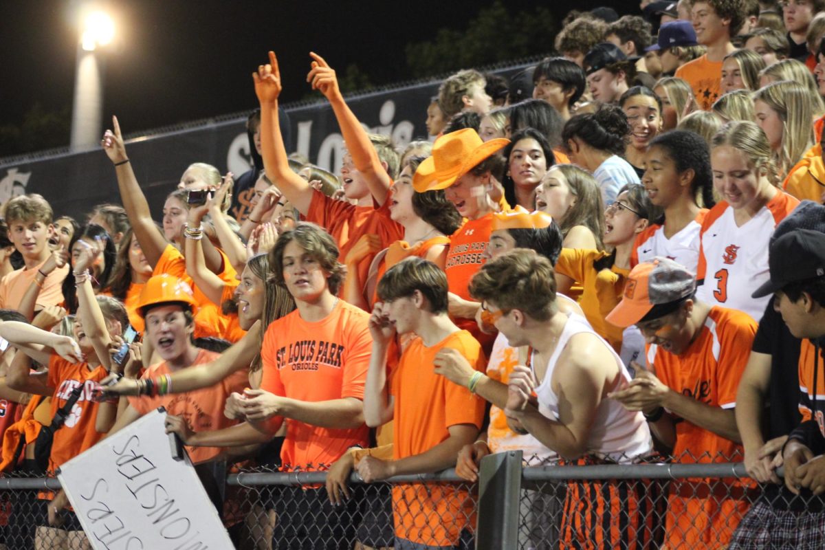 Student section demonstrates Park Pride with an orange out dress code on Sept. 14. The Orioles were fighting hard to try and get their lead back against Apple Valley.
