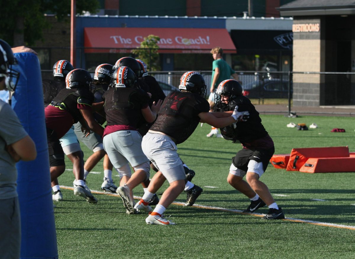 Sophomore Evan Cormier and other defensive linemen work in practice Sept. 19. After a loss to Apple Valley, the team looks to bounce back and have a successful rest of the season.