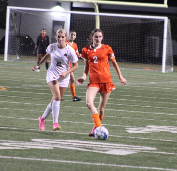 Junior Maisie Carlson passes the ball up field Sept. 18. Park won with a final score 2-1. 