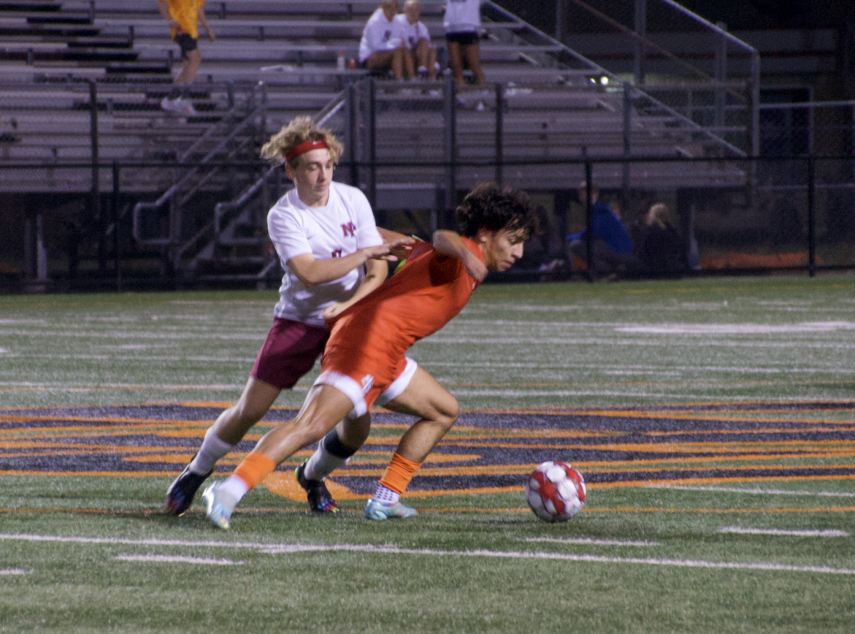 Junior Johnny Ryan dribbles the ball out of pressure Sept. 28. Park was defeated 1-0 by New Prague Thursday night.