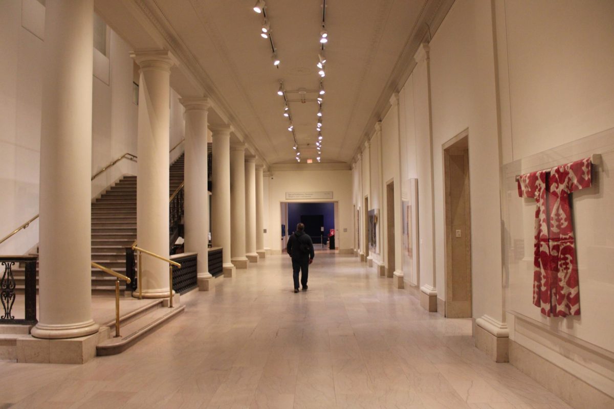 The hallway connecting the Asian and special exhibition art galleries at the Minneapolis Institute of Art. The columns connecting the floor to the ceiling are based on ancient European architecture. 