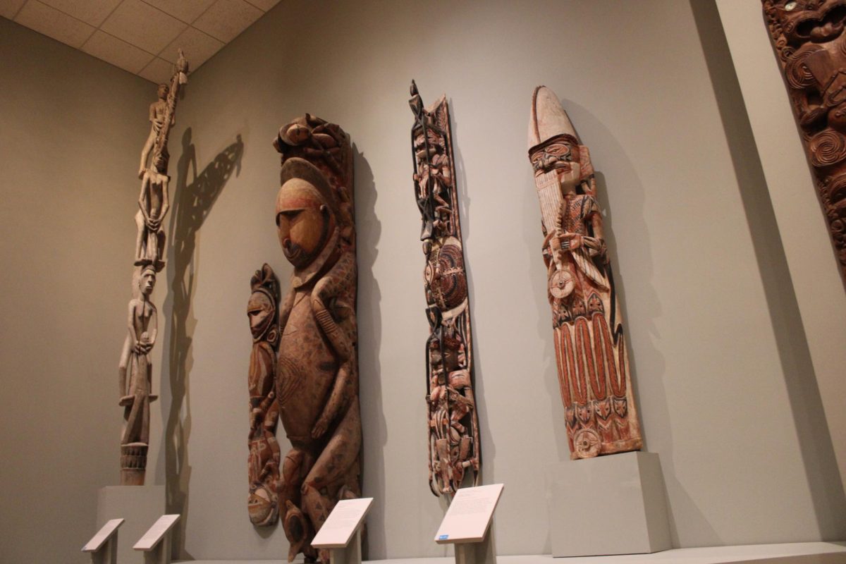 The Pacific Islands gallery at the Minneapolis Institute of Art. Five different cultural art pieces from islands all across the Pacific Ocean are hung on the wall. 