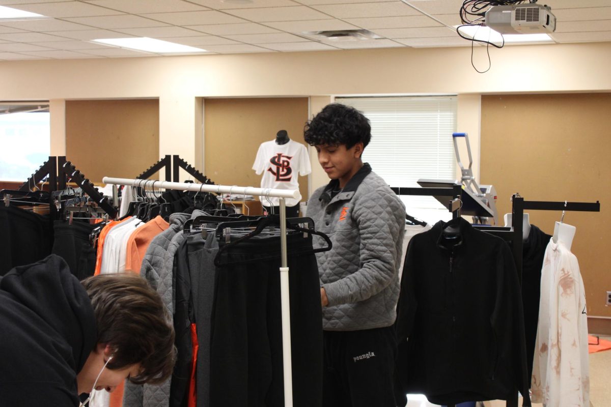 Junior Franklin Inamagua Sinchi shops at the Storiole for the new Stoirole bundle Dec. 14. The Storiole is open during fifth hour everyday.