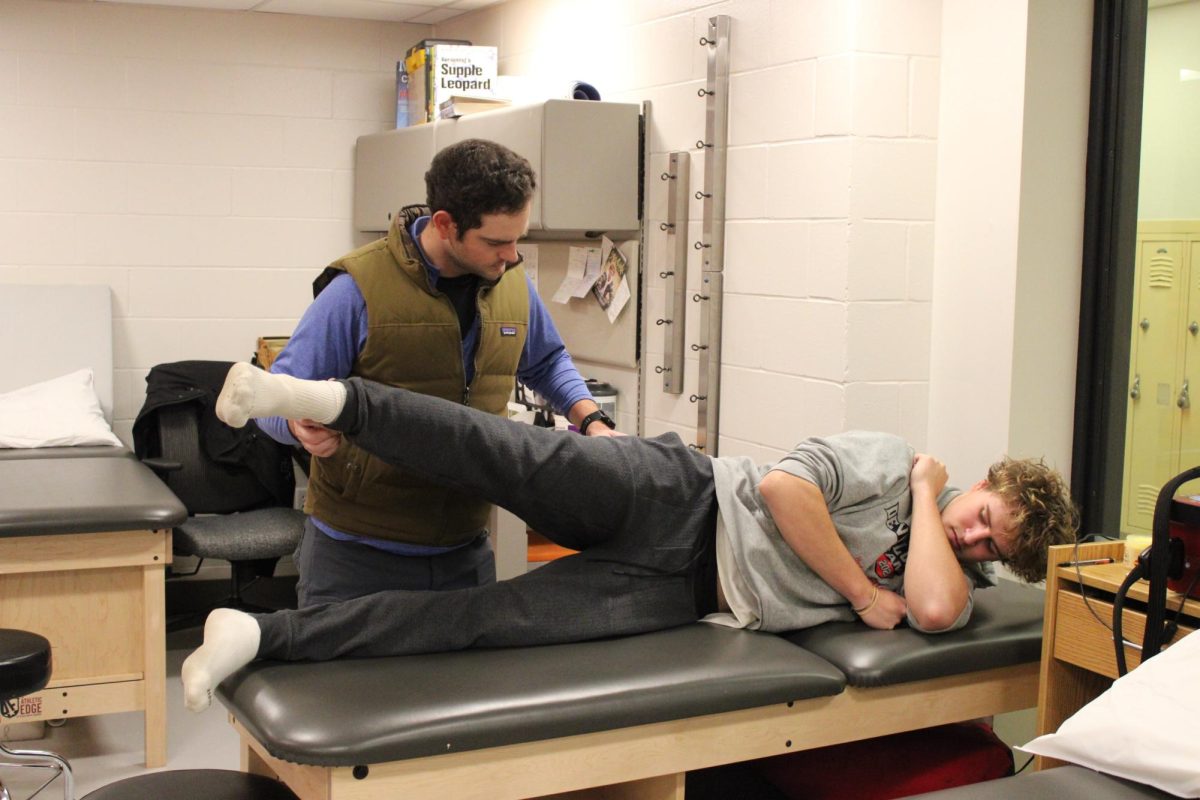 Senior Josh Middleton getting injury help by trainer Josh Brodersen on Dec 5. Athletic Injuries can take a toll on ones mental health. 
