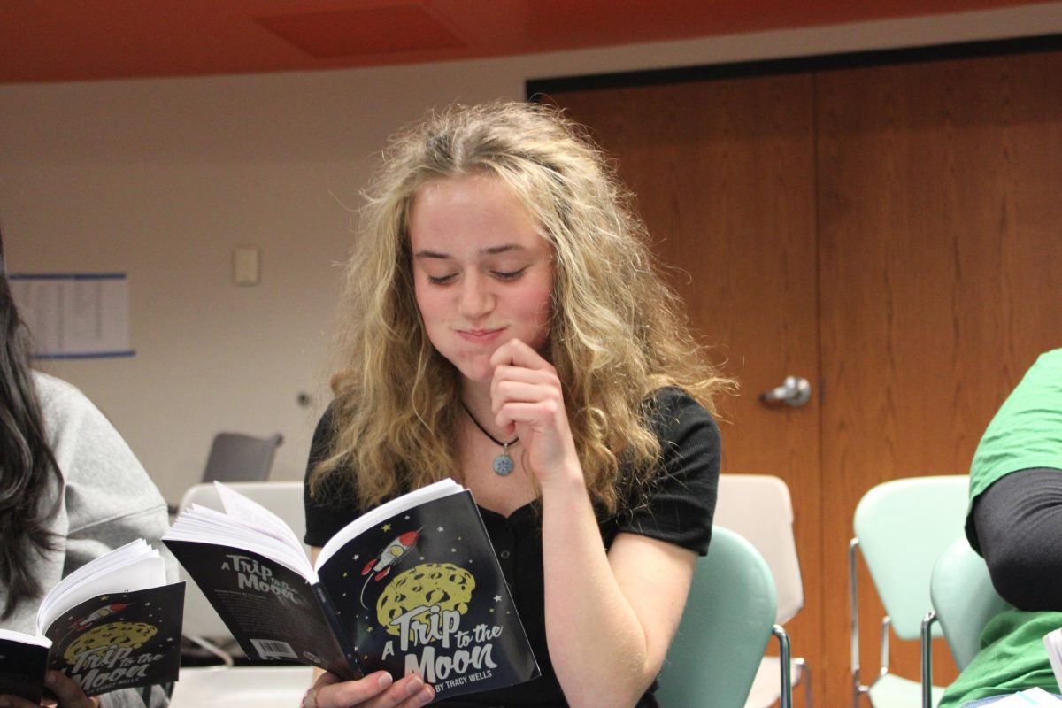 Junior Sela Myers acts out an eating scene during theater Dec. 5. Theater program is practicing for the winter One-Act play. 