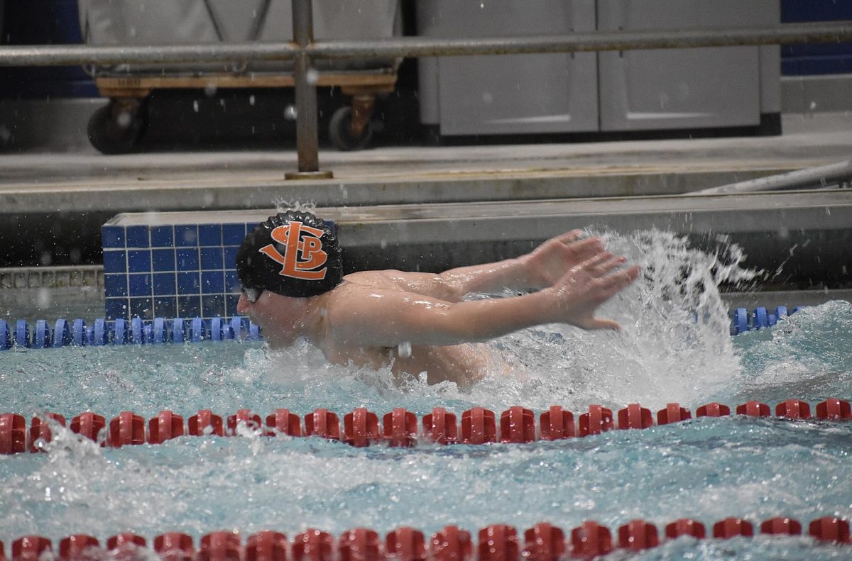 Eighth-grader Hutton Newhall swims the 100 fly Jan. 25. The boys team swam on Thursday against Orono.

