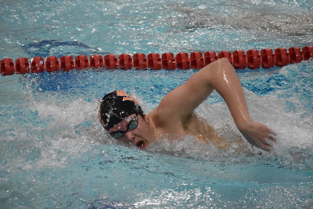Junior Finn Berry swims 500 free on Jan. 25. The boys lost to Orono 77-81 on Thursday.