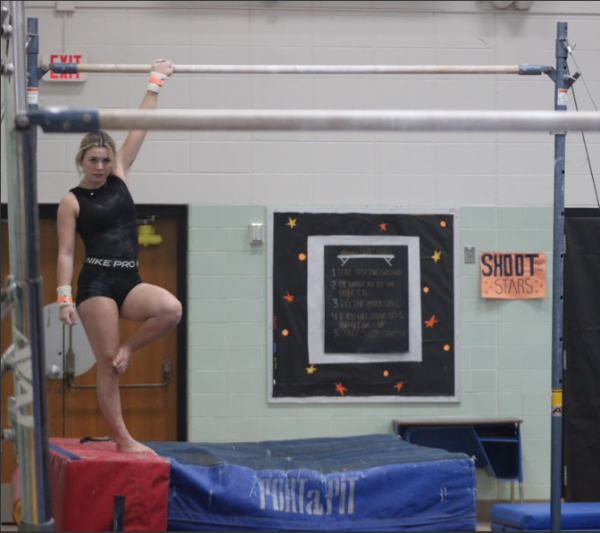 Sophomore Elsa Crow rehearses on the bars during girl’s gymnastics practice Jan. 14. The team prepares for their upcoming competitions.