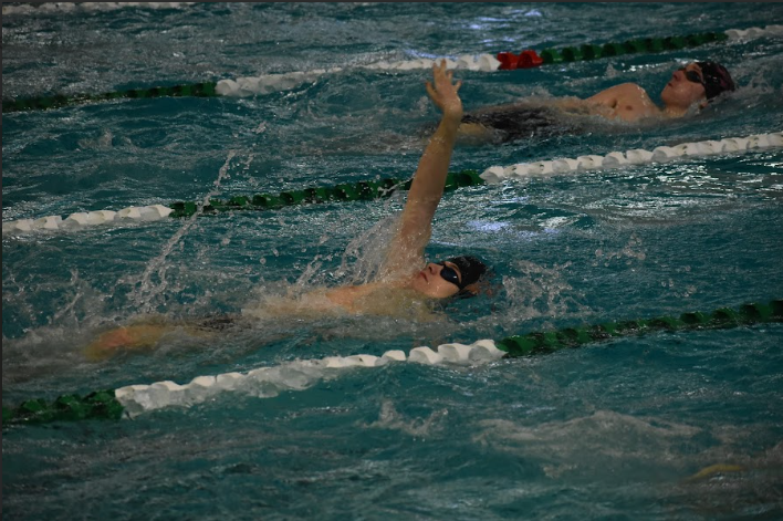 Junior Caleb Teichman swims backstroke on Jan. 13. The boys’ team swam at Edina on Saturday.