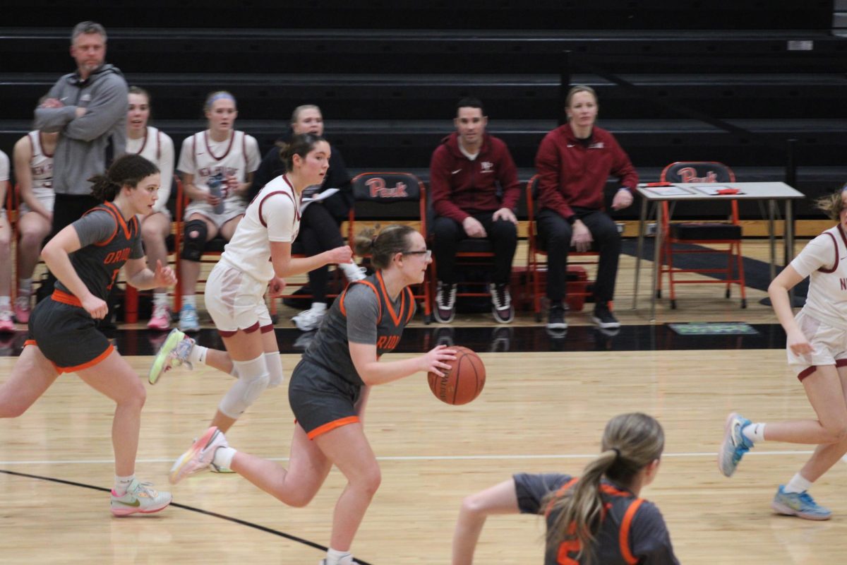 Senior Evelyn Schmitz rushes down the court to the basket. Park’s girls hussle to assist teammates Jan. 23. 