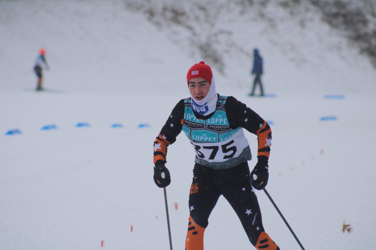 Senior Tommy Keller races to the finish line Jan. 13. The varsity boys nordic team at Park raced at Theodore Wirth Regional Park. 
