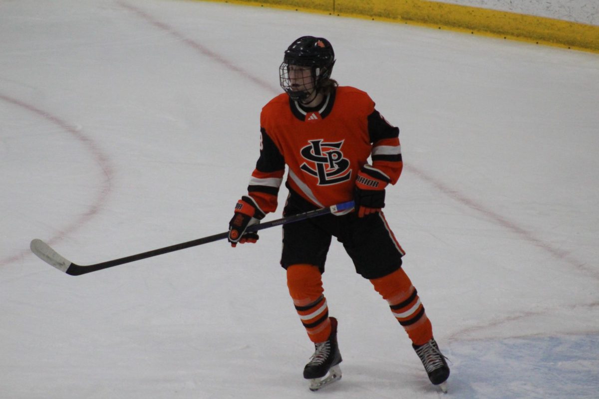 Sophomore Owen Anklam scans the ice for the puck. Park fell to Benilde 1-4 Jan. 9.