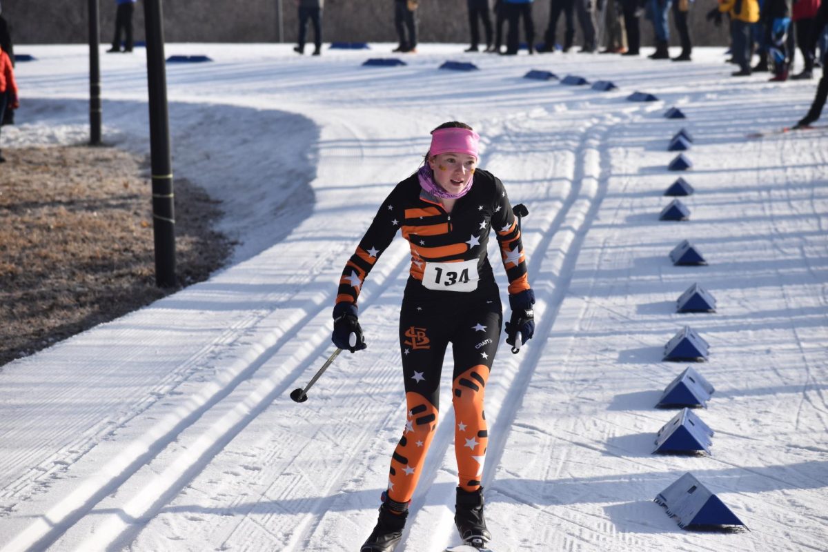 Junior Nora Lindeman finishes her classic race at sections Feb. 5. Lindeman finished in 11th place in the race.