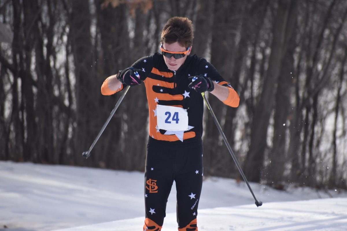 Senior Nolan Crump skis the classic relay for the boys team Feb. 5. Crump and his relay partner finished fourth in the relay race.