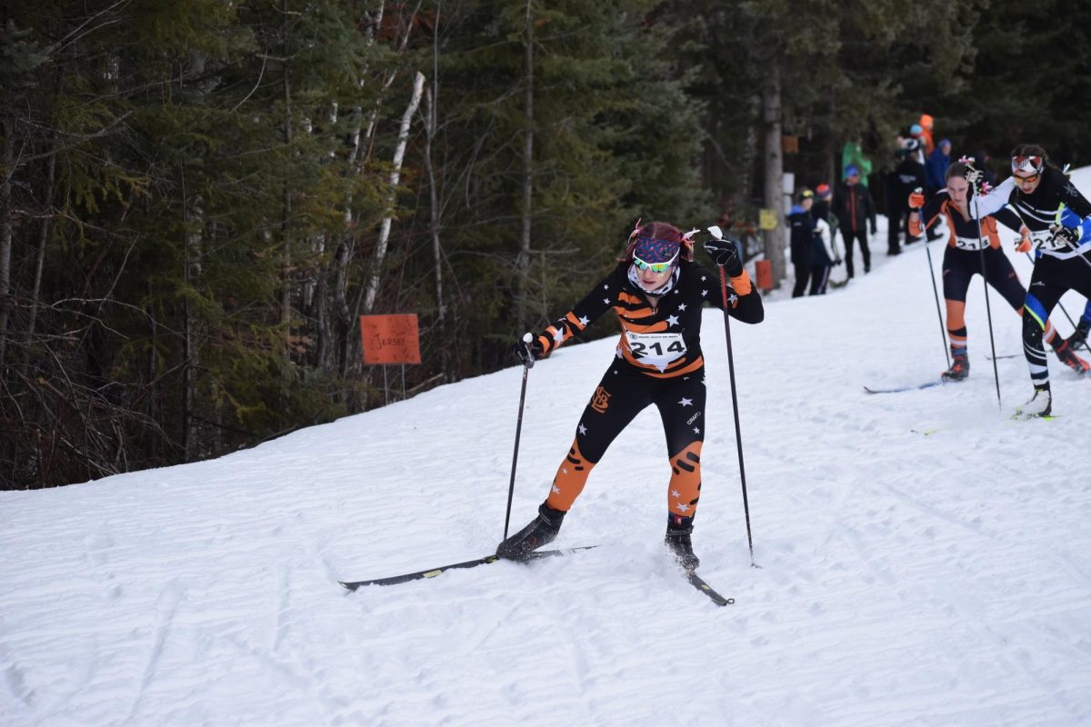 Senior Jersey Miller skis up the big hill on her second lap of the girls classic-interval qualifier on Feb 13. Miller helped lead the team to a third-place spot after the first day.