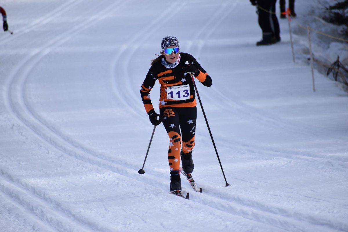 Sophomore Kaylee Crump skis in the tracks in the girls team sprint relay on Feb 14. She and her relay partner, senior Addison Chenvert finished 12th in team relays.