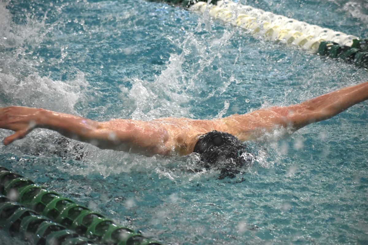 Senior Daniel Cameron swims the 100 Fly Feb. 24. The team placed 3rd overall in sections on Saturday.
