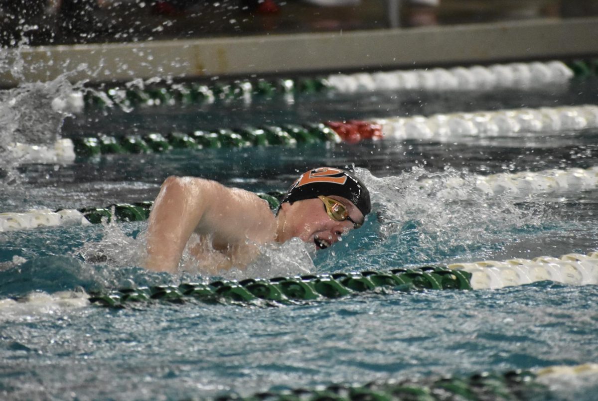 Junior Henry Berg swims the 500 free on Feb. 24. Berg qualified for the state swim meet in the event.