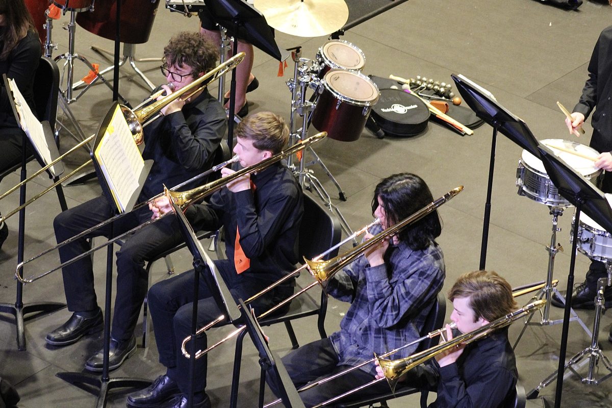 Juniors Max and Nils Runyon played the trombone in the bands annual pops concert Feb. 26. During the concert the band played recognizable fantasy songs in pop culture.