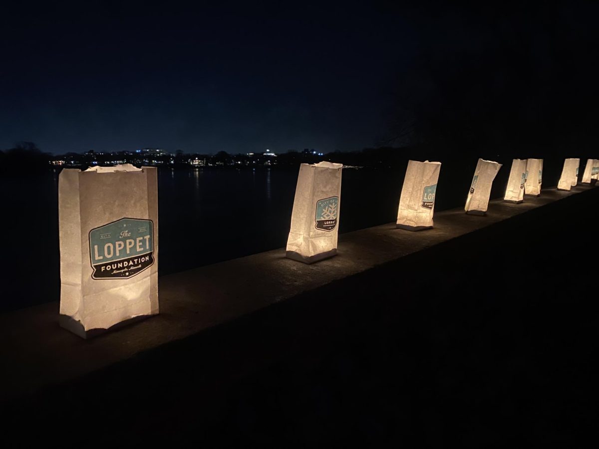 The+bridge+over+Lake+of+the+Isles+is+lit+with+paper+lanterns+Feb.+3.+The+Luminary+Loppet+moved+from+ice+to+land+as+a+result+of+warmer+temperatures.
