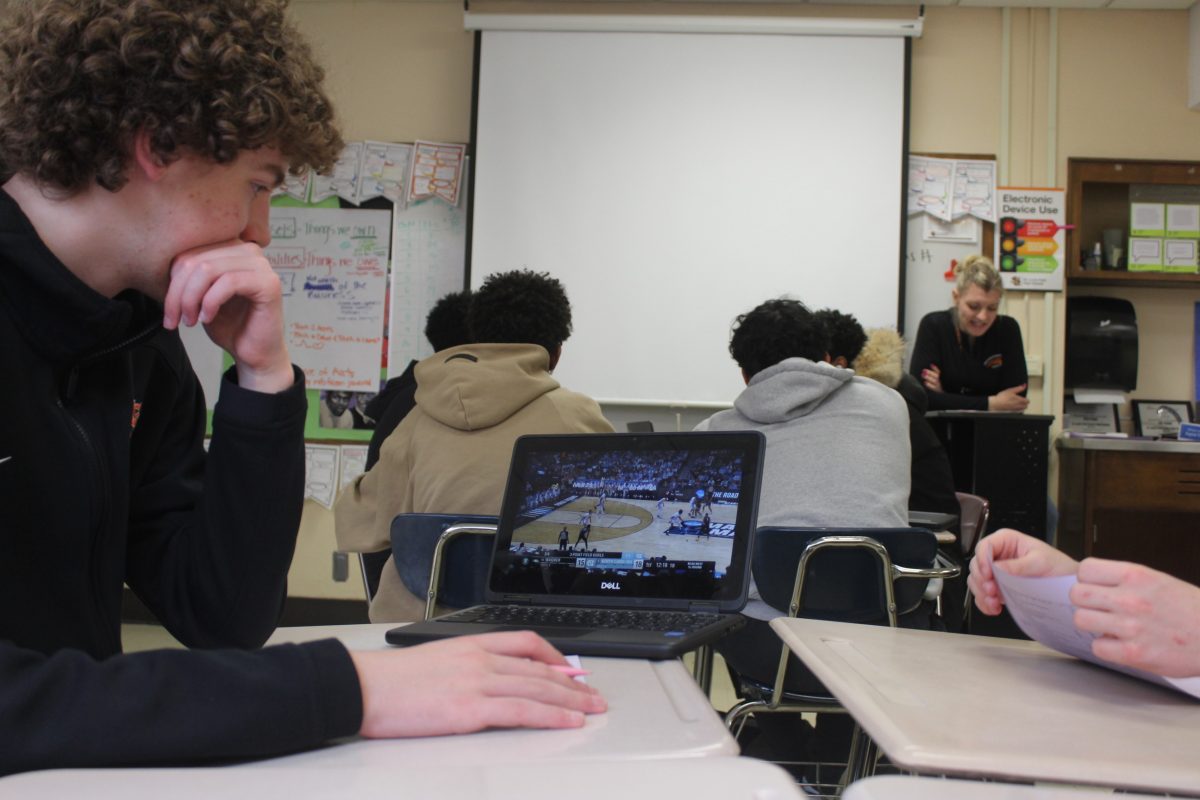 Sophomore Jacob Natzel watches the first round of March Madness in class March 21. Watching college basketball during school is very popular this time of year.