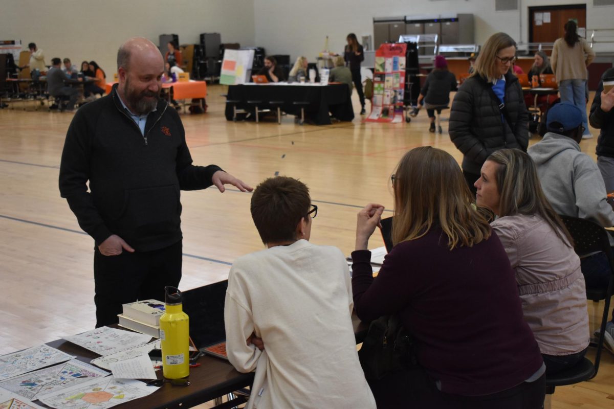 Park parent Colin Cox engages with teachers at Family Engagement Day April 19. Students had an asynchronous day while parents had the opportunity to learn about what their students do at school.
