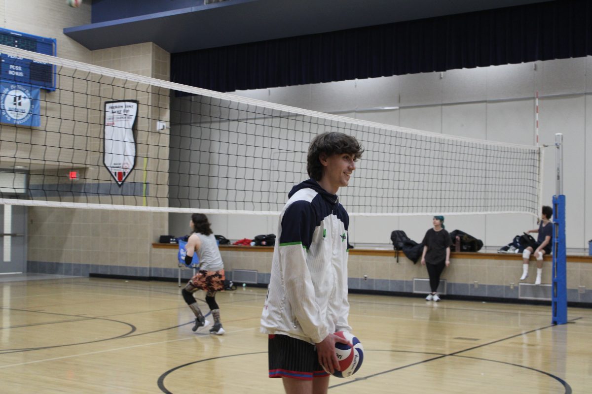 Junior+Owen+Barnett+is+practicing++for+his+first+year+of+high+school+volleyball+on+Mar.+28.+The+next+boys+volleyball+game+is+Apr.+15+at+6+p.m.