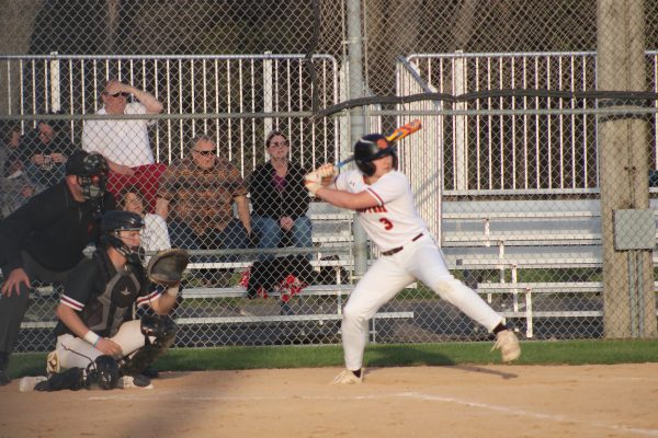 Sophmore Miles Jungroth loads up for a swing April 25. Park took a big loss to New Prague 7-1.