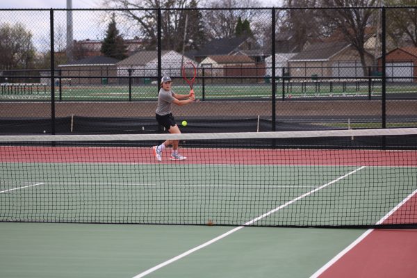 Junior Crew Lund Pounds the ball back to the opponent on 4/17. Boys tennis almost gets the sweep against Minneapolis South with a 6-1 win.