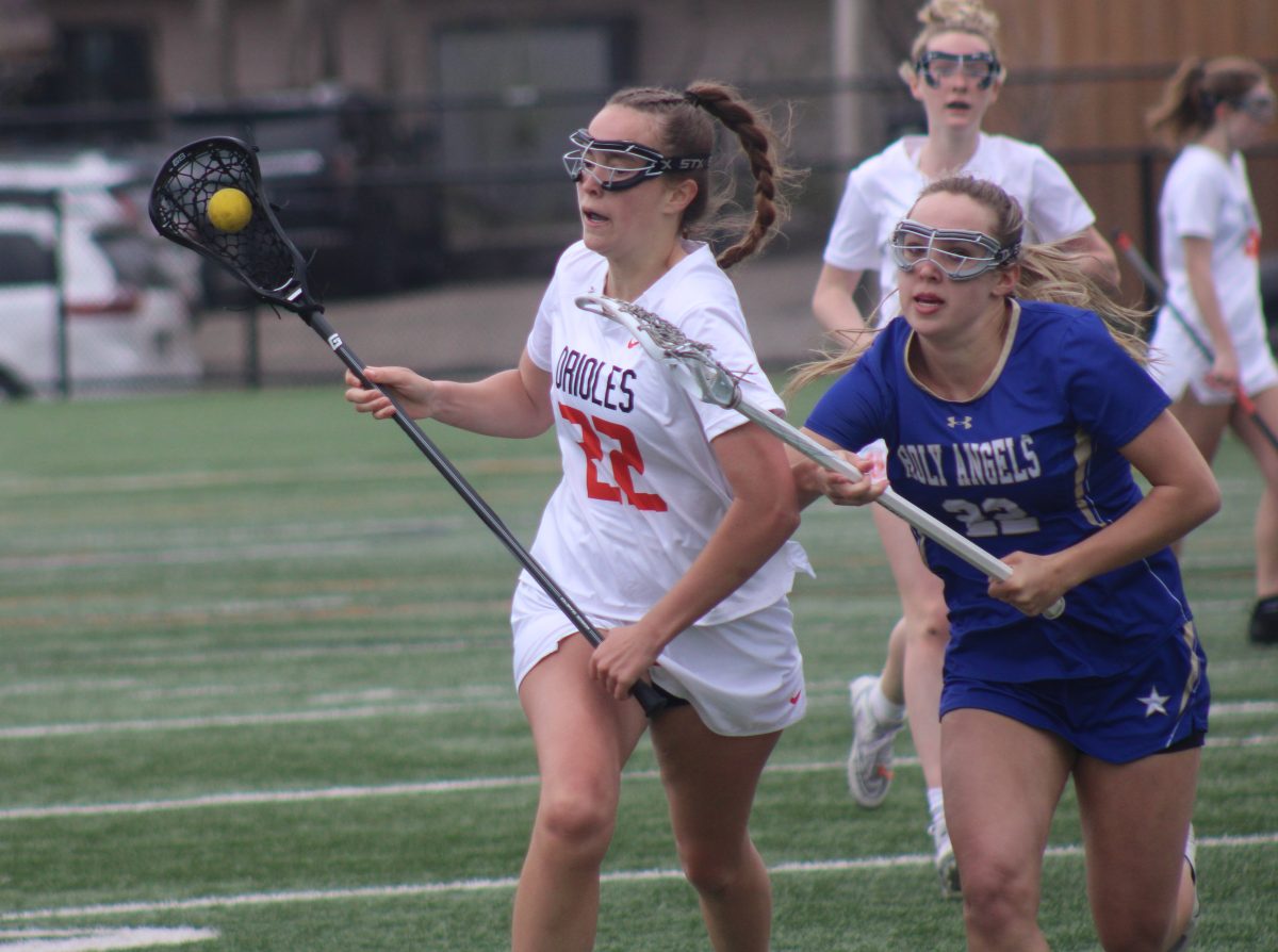 Junior Kate Grimm cradles the ball April 27. Park finished the comeback and beat Holy Angels 11-10.