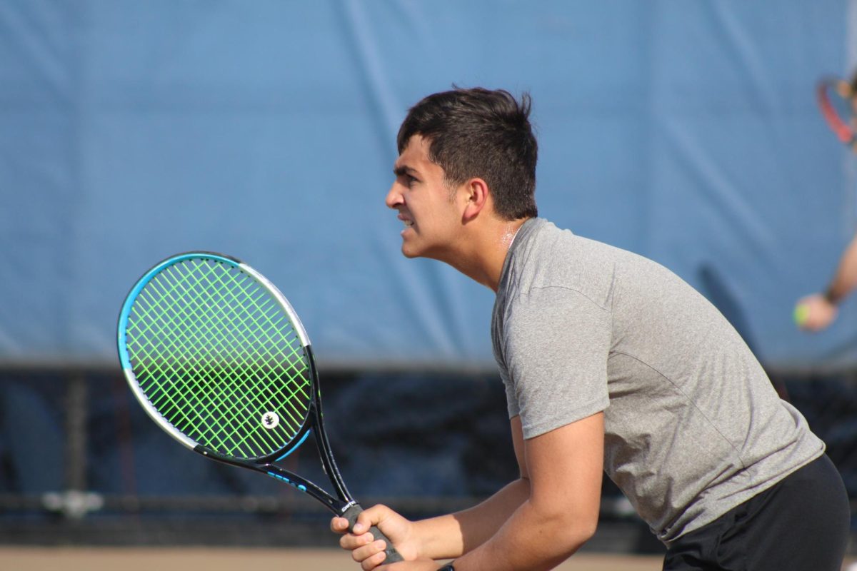Junior Josh Fink awaits serve from Chanhassen’s boys tennis team April 11. Park boys swung into the season with a tough loss against the Storm. 