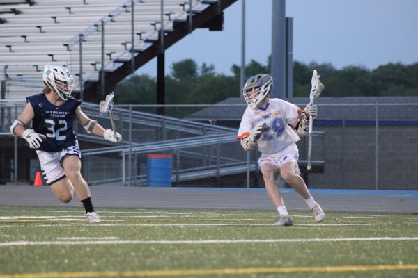 Hopkins-Park player tries to get around his defender May 14. Hopkins-Park Boys Lacrosse lost 7-10 on senior night.
