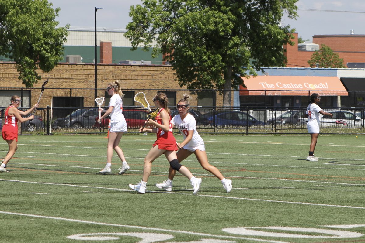 Senior Lilly Fandel-Thompson defends an opposing player May 18. Park won 12-13 after making a comeback during the second half.