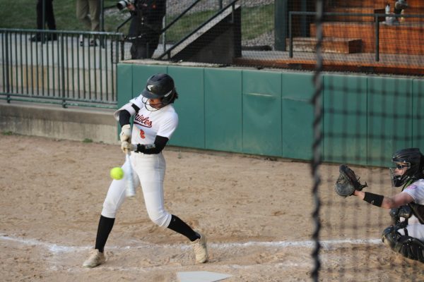 Junior Eva Taybior hits the ball April 24. Park took a close loss against Chanhassen, ending with a score of 11-10.