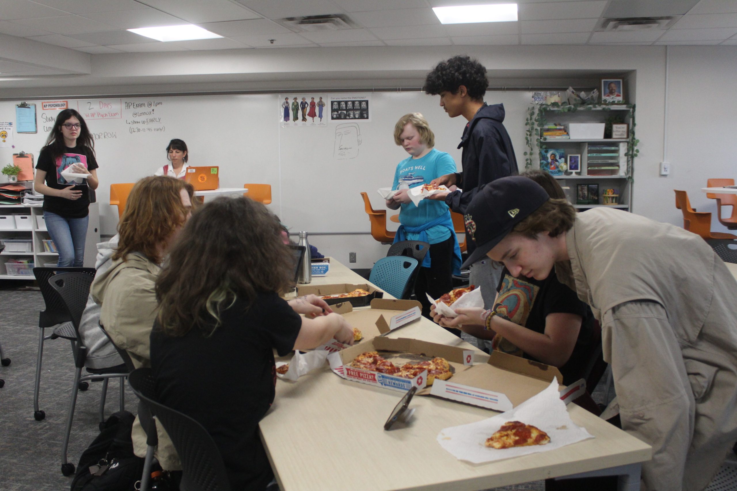Art club students gather for a pizza party May 7. This was the last art club meeting of the year.