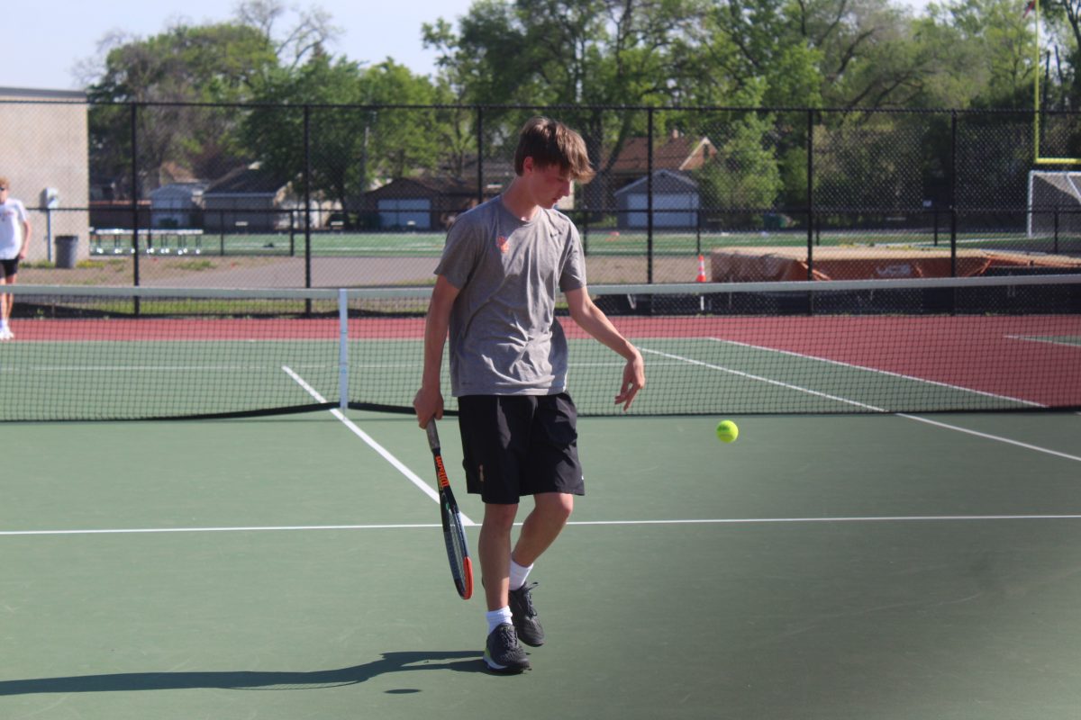 Freshman Logan Peterson prepares to serve the ball May 13. This was Parks second match against Chaska due to rescheduling.