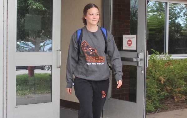 Senior Ruby Massie walks to her bus. Massie participated in her last section track meet before state May 30.